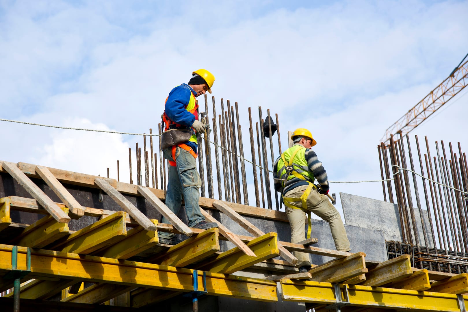 Construction workers reviewing work