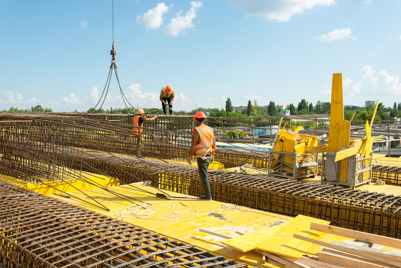 Workers installing reinforcement structures
