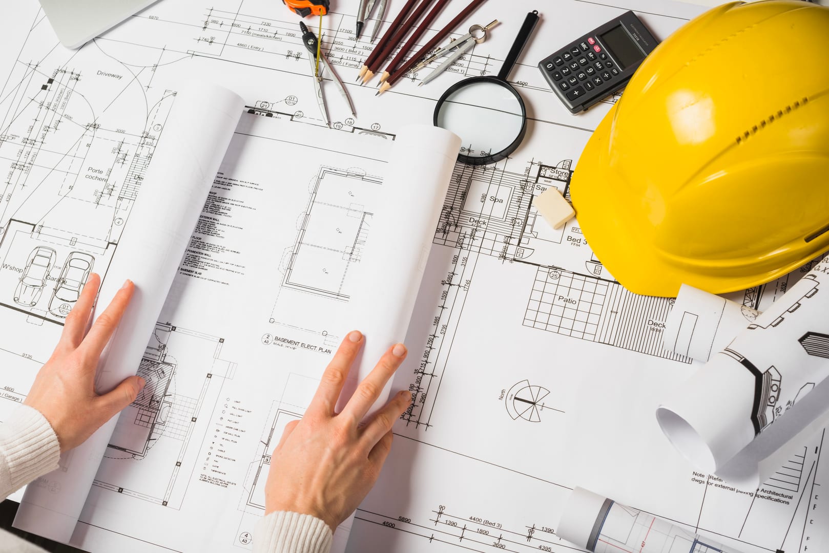 Architect reviewing blueprints
