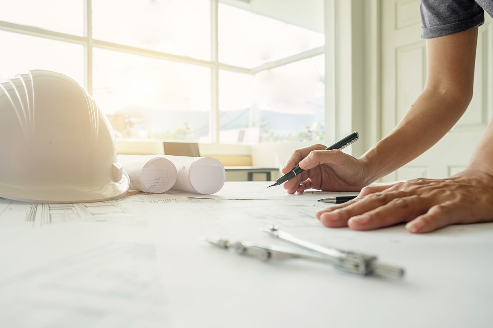 Engineer working on blueprints